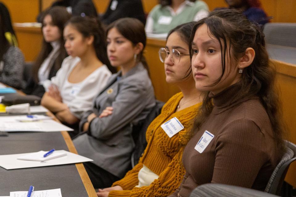 High school students from Des Moines Public Schools listen as four Drake University law students share their experiences during a panel event Tuesday, March 7, 2023.