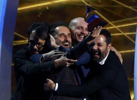 Jorge Drexler (2nd L) celebrates winning record of the year for "Universos Paralelos" at the 15th Annual Latin Grammy Awards in Las Vegas, Nevada November 20, 2014. REUTERS/Mike Blake