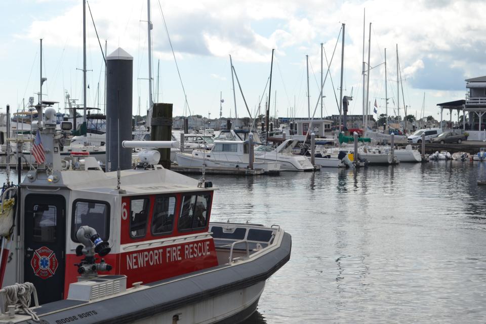 The Newport Fire Rescue boat sits in Newport Harbor on a calm day ahead of the potential arrival of Hurricane Lee.