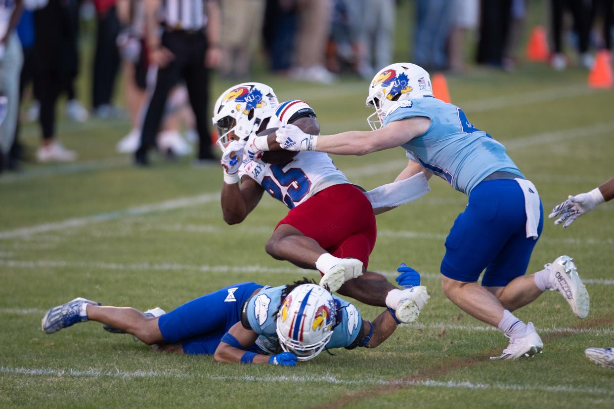 Kansas freshman running back Harry Stewart III (25) looks to make a move during the Jayhawks' spring showcase event in April at Rock Chalk Park.