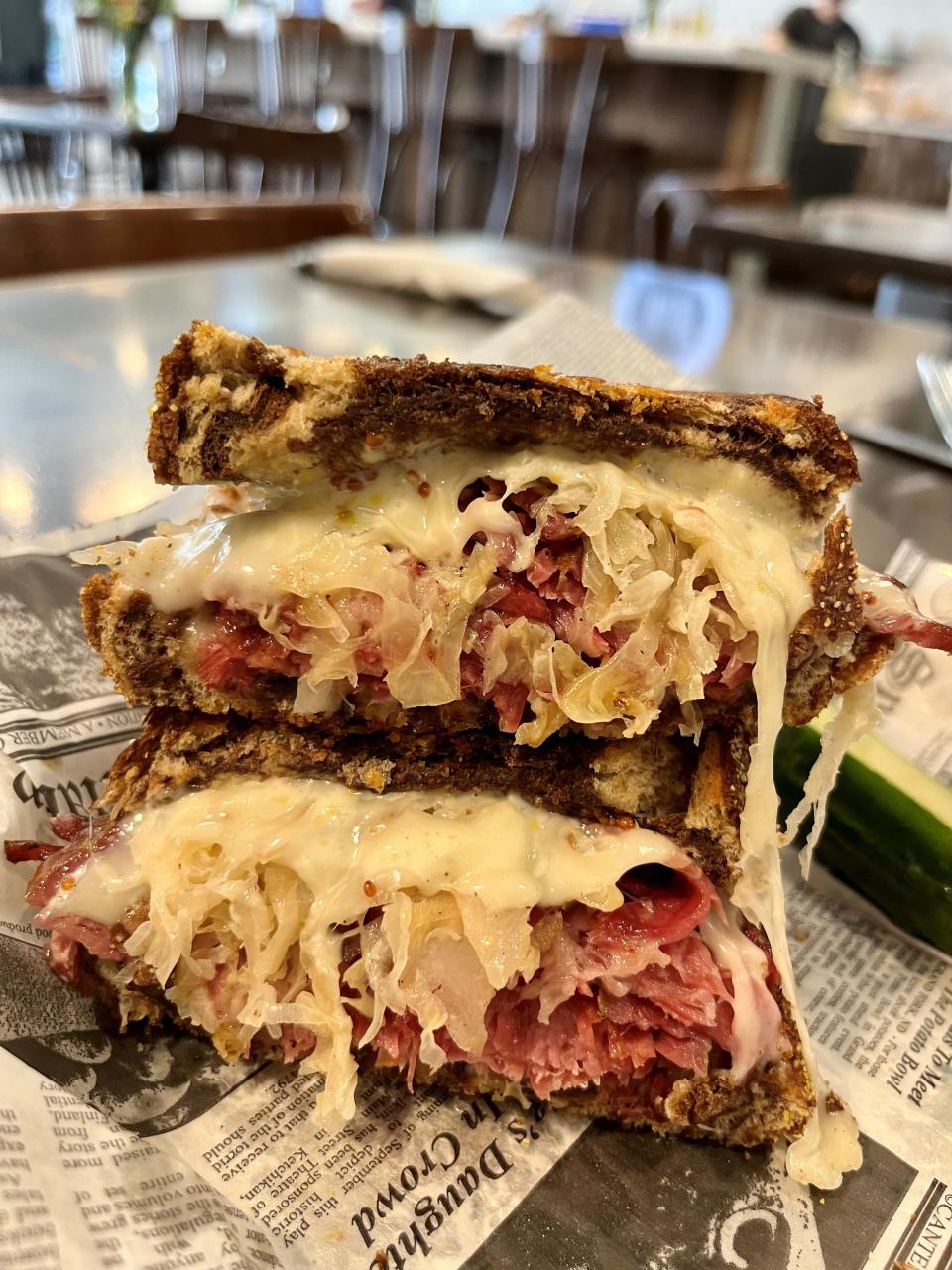 Artisan Eatery's New Yorker features house-made pastrami, lovingly layered with sauerkraut and Swiss cheese, with beer mustard aioli on marble rye.