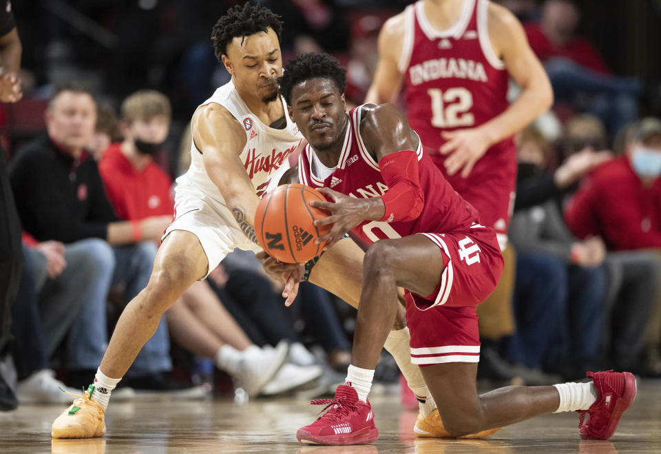 Nebraska's Trey McGowens, left, defends against Indiana's Xavier Johnson (0) during the first half of an NCAA college basketball game Monday, Jan. 17, 2022, in Lincoln, Neb. (AP Photo/Rebecca S. Gratz)