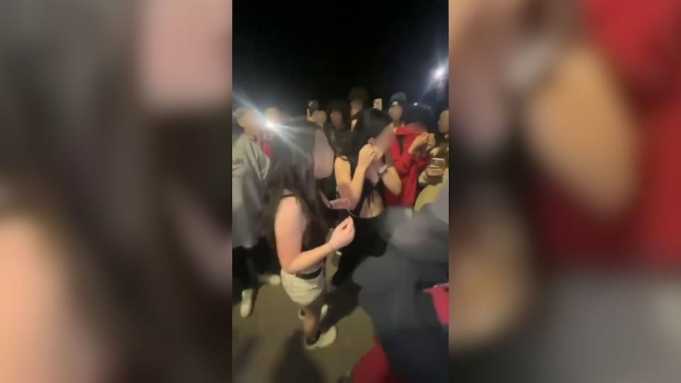 In the video, a number of teenagers are seen to attack the girl, including throwing dirt on her.