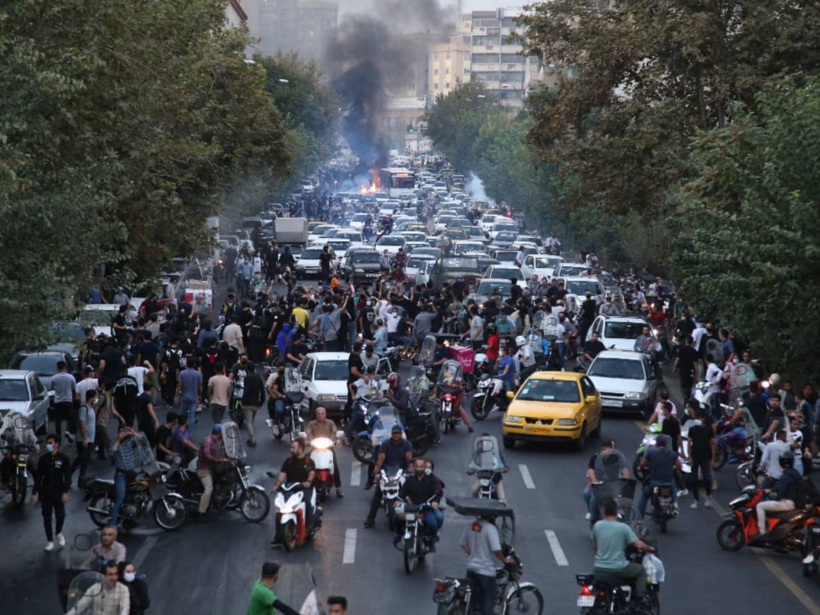 Demonstrators mass in the streets of the capital Tehran during a protest for Mahsa Amini, days after she died in police custody, on September 21, 2022. (AFP/Getty Images - image credit)