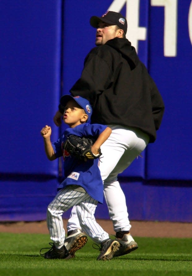 Mahomes, seen here in his youth with former New York Mets pitcher Mike Hampton, grew up around baseball thanks to his father's 11-year MLB career.