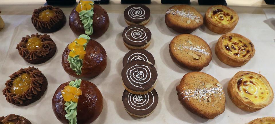 Sweet treats, left to right, chocolate brownie with caramel milk chocolate ganache, pistachio with mango jelly maritozzi, millionaire's shortbread, almond bostock and vanilla flan await customers at Ma Façon TR in Poulsbo on Thursday, June 13, 2024.