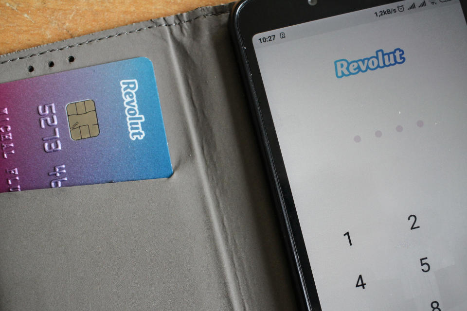 Revolut card next to of Android Revolut mobile app launched on the smartphone is seen in Gdansk, Poland on 9 July 2019 
Revolut reached over 400.000 users in Poland this year. The number of Polish clients increased by 100% in 9 months period.
Revolut Ltd is a UK financial technology company that offers banking services  (Photo by Michal Fludra/NurPhoto via Getty Images)