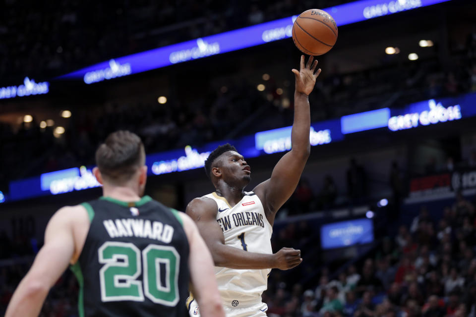 New Orleans Pelicans forward Zion Williamson (1) shoots in front of Boston Celtics forward Gordon Hayward (20) in the first half of an NBA basketball game in New Orleans, Sunday, Jan. 26, 2020. (AP Photo/Gerald Herbert)