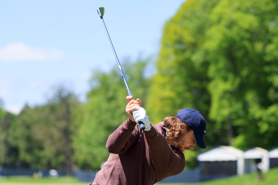 Tommy Fleetwood hits at the driving range in preparation for the PGA Championship at Oak Hill Country Club.