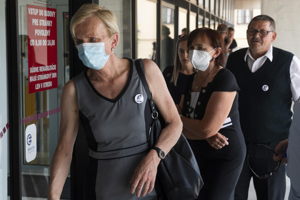 Zlatica Kusnirova, left, mother of Kuciak's fiancee Martina Kusnirova; and Jana Kuciakova and Jozef Kuciak, parents of murdered Jan Kuciak arrive at the Supreme Court in Bratislava, Slovakia, Tuesday, June 15, 2021. Slovakia’s appeals court has dismissed a lower court verdict that acquitted a businessman accused of masterminding the 2018 slayings of an investigative journalist who had written about him and the journalist’s fiancee. The verdict by Slovakia’s Supreme Court means that the case now returns to the Specialized Criminal Court in Pezinok that ruled in September to clear the businessman, Marian Kocner, and one co-defendant of murder in the killings of journalist Jan Kuciak and his fiancee, Martina Kusnirova, both 27. (Jaroslav Novak/TASR via AP)