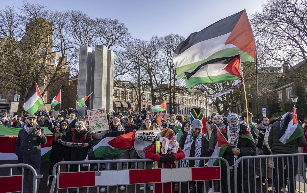 People gather outside the International Court of Justice during the session on the day it ruled on Gaza genocide case against Israel made by South Africa