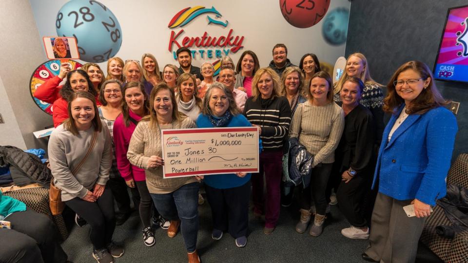 PHOTO: A group of former and current staffers at Rector A. Jones Middle School in Florence, Ky., call themselves the “Jones 30.” They won $1 million together on a Powerball ticket this week. (Stuart Hammer/Kentucky Lottery)