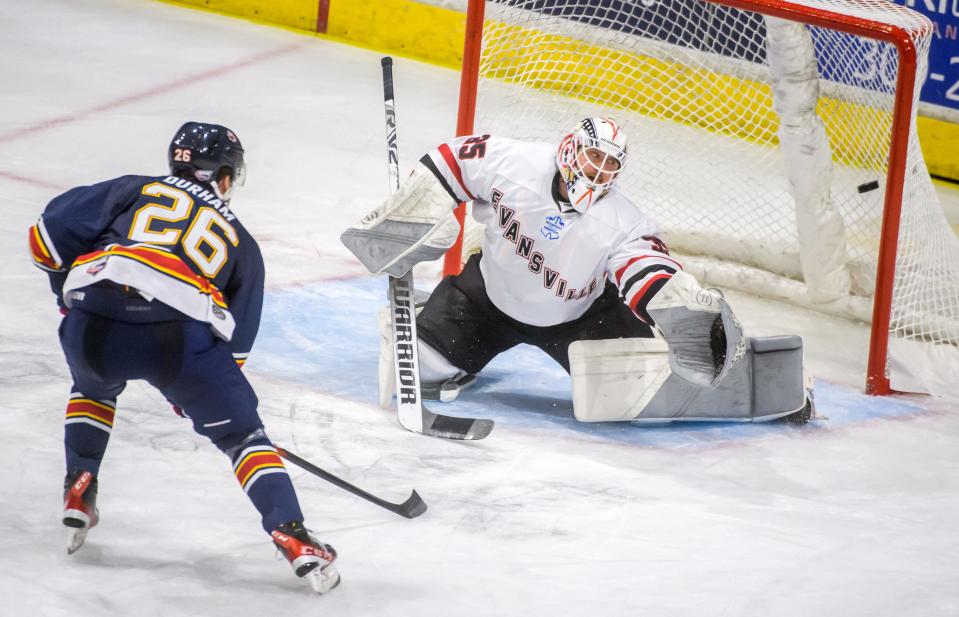 New Rivermen center Andrew Durham slips a shot past Evansville goaltender Zane Steeves in the second period Friday, Dec. 30, 2022 at Carver Arena. The Rivermen defeated the Thunderbolts 5-1.