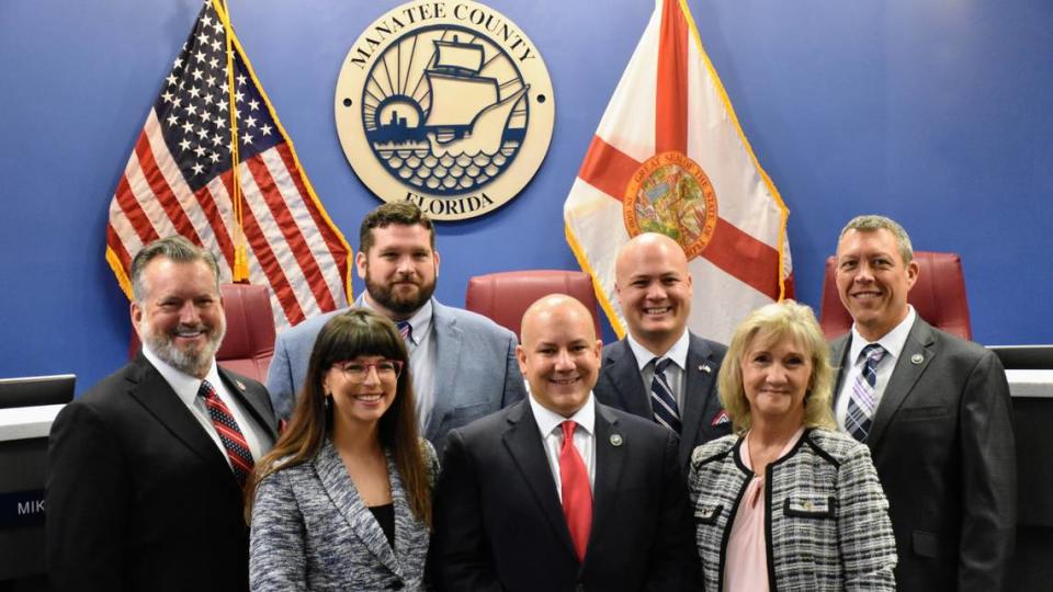 From left: Manatee County Commissioners Mike Rahn, Amanda Ballard, James Satcher, Kevin Van Ostenbridge, Jason Bearden, Vanessa Baugh and George Kruse pose for a photo after newly elected commissioners were sworn into 4-year terms on the Board of County Commissioners on Nov. 22, 2022.