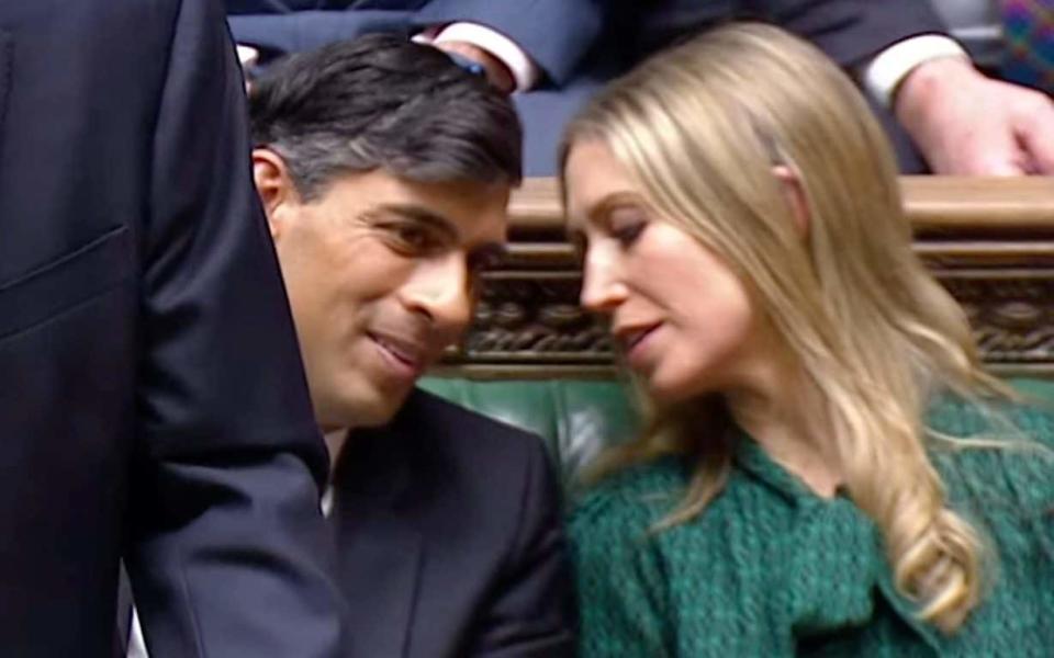 Rishi Sunak and Laura Trott speak during the Budget speech