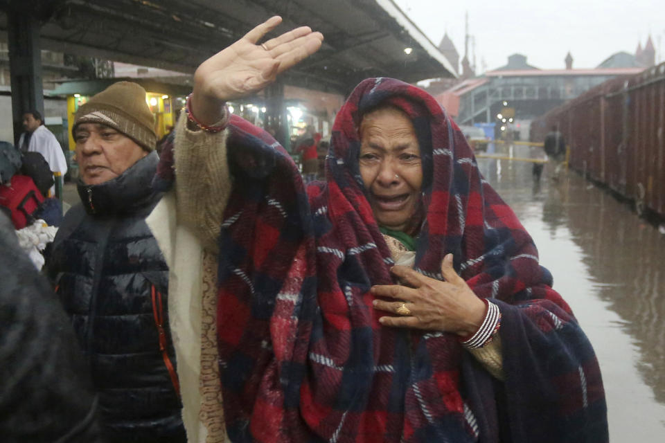 A Pakistani woman sees off her relatives travel to India via Samjhota Express at Lahore railway station in Pakistan, Thursday, Feb. 21, 2019. Indian authorities suspended a bus service this week without explanation. The development comes amid escalated tensions between Pakistan and India in the wake of last week's deadly suicide bombing in Kashmir against Indian paramilitary troops. (AP Photo/K.M. Chaudary)