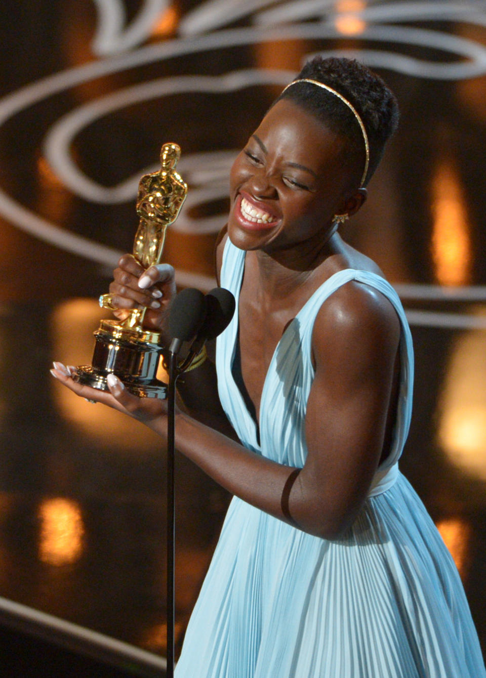 Lupita Nyong’o accepts the award for best actress in a supporting role for "12 Years a Slave" during the Oscars at the Dolby Theatre on Sunday, March 2, 2014, in Los Angeles. (Photo by John Shearer/Invision/AP)