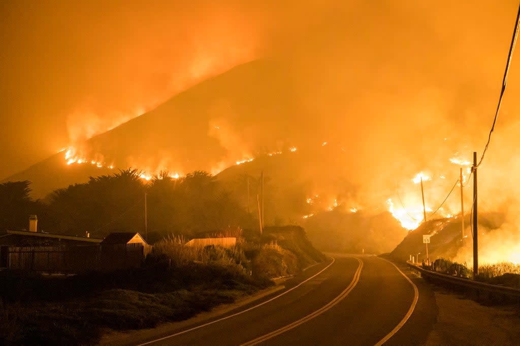 The Colorado Fire burns along Highway 1 near Big Sur, California on 22 January 2022 (Nic Coury/AP)
