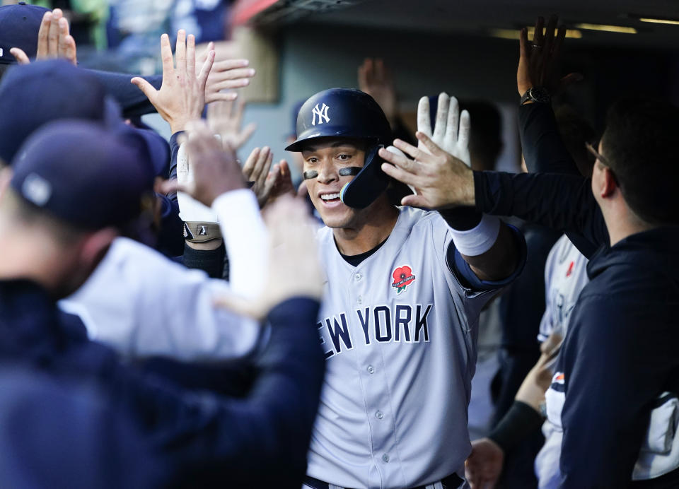 New York Yankees' Aaron Judge celebrates after his two-run home run against the Seattle Mariners during the third inning of a baseball game Monday, May 29, 2023, in Seattle. (AP Photo/Lindsey Wasson)