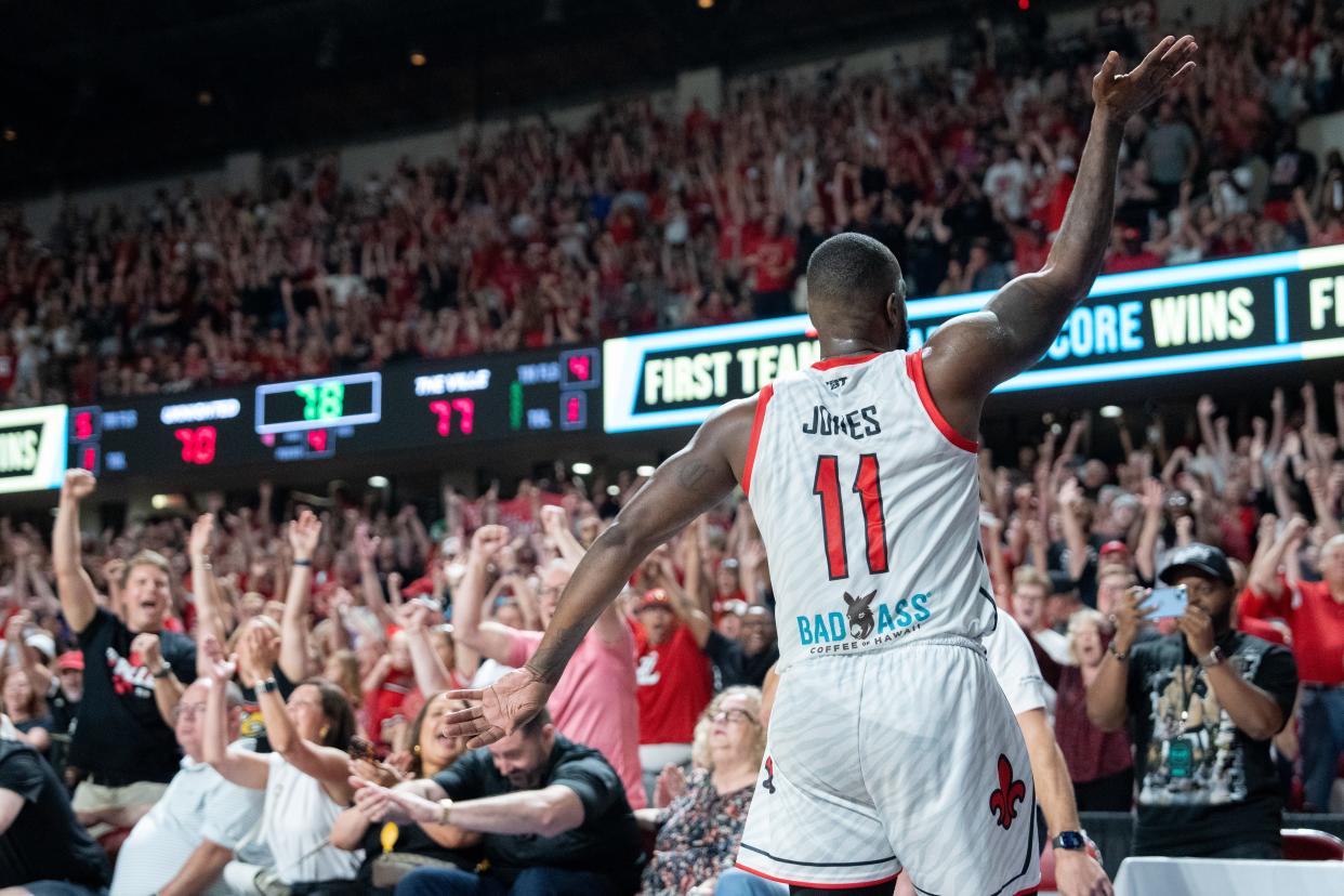 The Ville's Chris Jones (11) celebrates making the winning basket against UKnighted during their game on Saturday, July 20, 2024 in Louisville, Ky. at Freedom Hall during the first round of The Basketball Tournament.