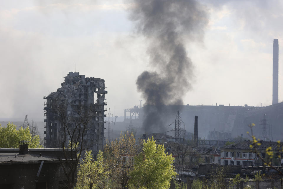 Smoke rises from the Metallurgical Combine Azovstal in Mariupol, in territory under the government of the Donetsk People's Republic, eastern Ukraine, Wednesday, May 4, 2022. (AP Photo/Alexei Alexandrov)