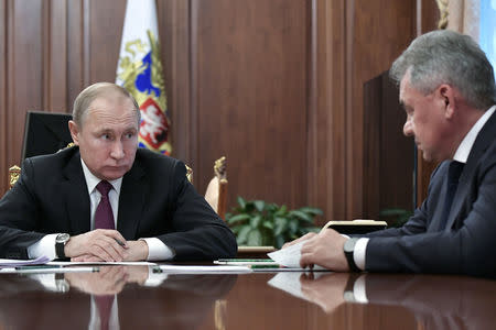 Russian President Vladimir Putin meets with Defence Minister Sergei Shoigu and Foreign Minister Sergei Lavrov at the Kremlin in Moscow, Russia, February 2, 2019. Sputnik/Alexei Nikolsky/Kremlin via REUTERS