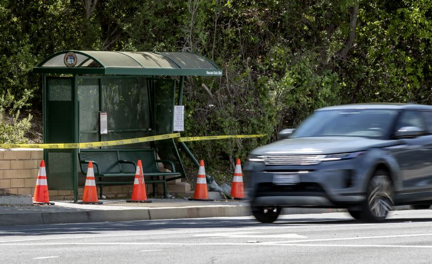 THOUSAND OAKS, CA-APRIL 20, 2023: Yellow caution tape is placed around the damaged bus stop on Thousand Oaks Blvd. in Thousand Oaks, near Westlake High School, where a man intentionally plowed into a group of teens, killing 15 year old student Wesley Welling. (Mel Melcon / Los Angeles Times)