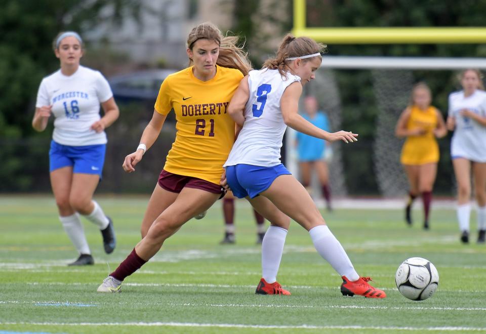 Doherty's Nicollette Kiorpes fakes out Worcester Tech/North defender Hailey Forrest, by passing the ball around her, as she moves in for a score.