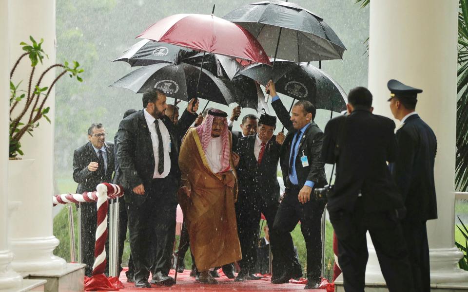 1,500 people, two Mercedes Benzes, 459 tonnes of luggage and a golden escalator: how the Saudi King travels