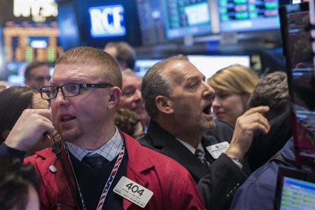 Traders work on the floor of the New York Stock Exchange shortly after the opening bell in New York April 4, 2014. REUTERS/Lucas Jackson