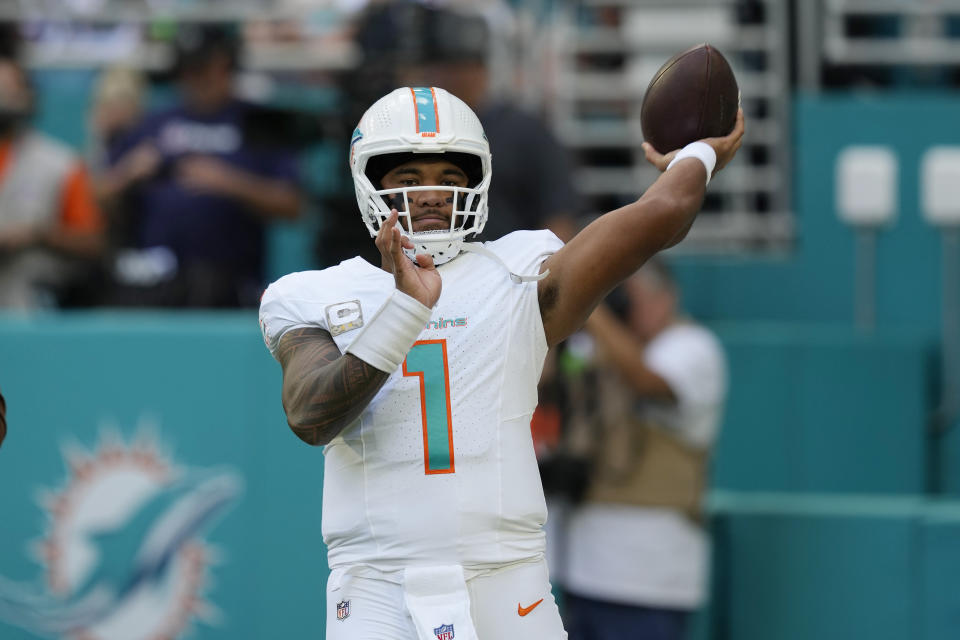 Miami Dolphins quarterback Tua Tagovailoa (1) warms up before an NFL football game against the Las Vegas Raiders, Sunday, Nov. 19, 2023, in Miami Gardens, Fla. (AP Photo/Rebecca Blackwell)