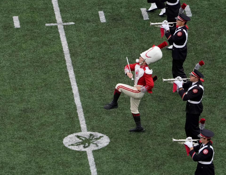 Oct. 7, 2023; Columbus, Oh., USA; 
Drum major Clayton Callender takes the field with the Ohio State University marching band before Saturday's NCAA Division I football game against the Maryland Terrapins at Ohio Stadium.