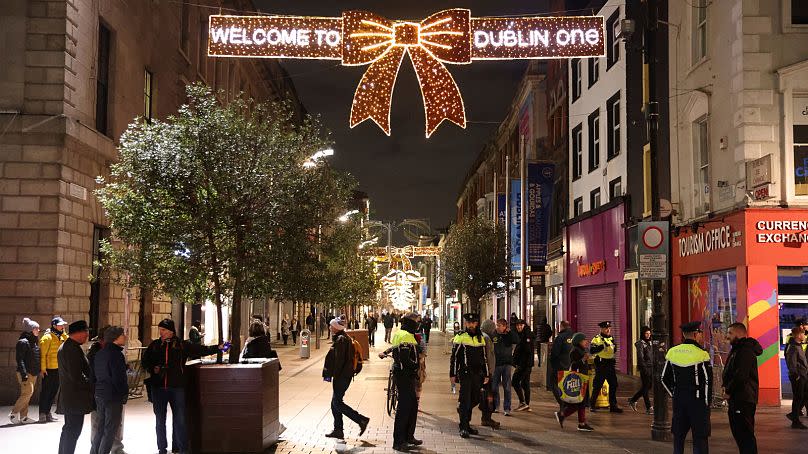 Irish Police patrol central Dublin, Friday, Nov. 24, 2023, police maintained a large presence following a night of protests and violence on Thursday.