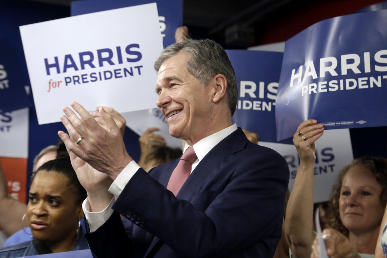 N.C. Governor Roy Cooper applauds one of the other speakers at a press conference, Thursday, July 25, 2024, in Raleigh, N.C. Cooper is one of the people being considered to be likely Democratic presidential candidate Vice President Kamala Harris' running mate. (AP Photo/Chris Seward)