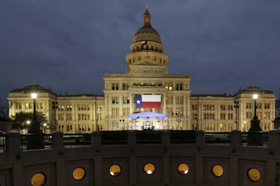In this Jan. 14, 2019 file photo, a large Texas flag hangs from the Texas State Capitol in Austin, Texas. (AP Photo/Eric Gay, File)
