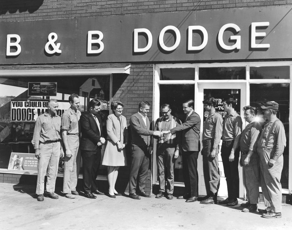 On  April 26, 1970, surrounded by their employees, three brothers from Honesdale opened B&B Dodge. Pictured (left to right) are Wes Weber, Bill Tennant, Gary Peck, Agnes Weidner, Bob Carmody, Bob McKinnell, John Carmody, Dennis Jennings, Steve Carmody, Art Meyer, and Charlie Schaff.