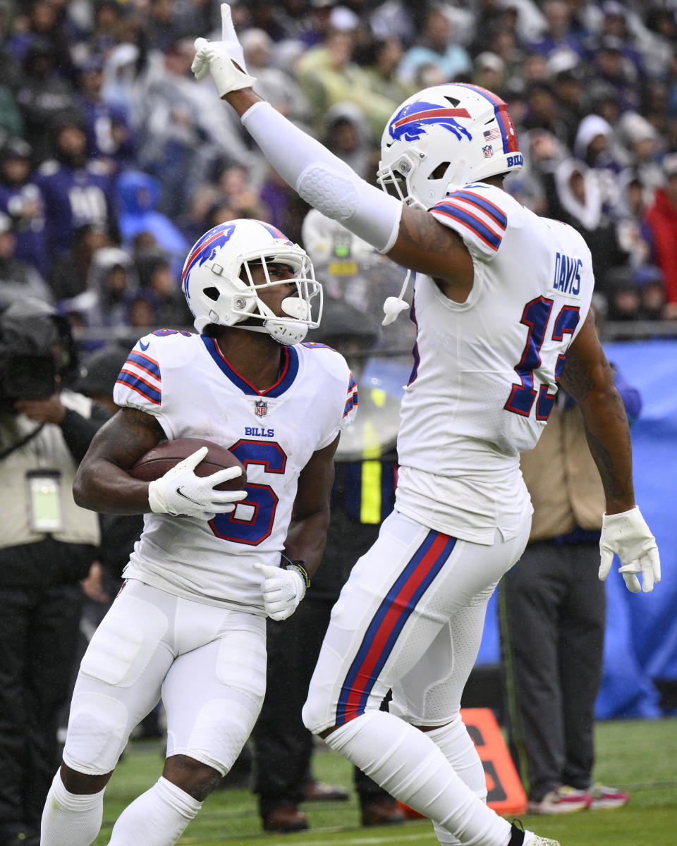 Buffalo Bills wide receiver Isaiah McKenzie (6) celebrates with Gabe Davis (13) after McKenzie scored a touchdown against the Baltimore Ravens in the first half of an NFL football game Sunday, Oct. 2, 2022, in Baltimore. (AP Photo/Nick Wass)