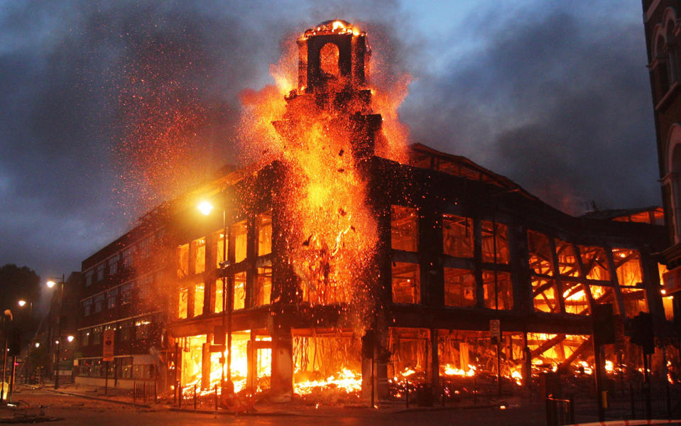 Fire rages through a building in Tottenham, north London on Saturday night as trouble flared after members of the community took to the streets last night to demand 'justice'.