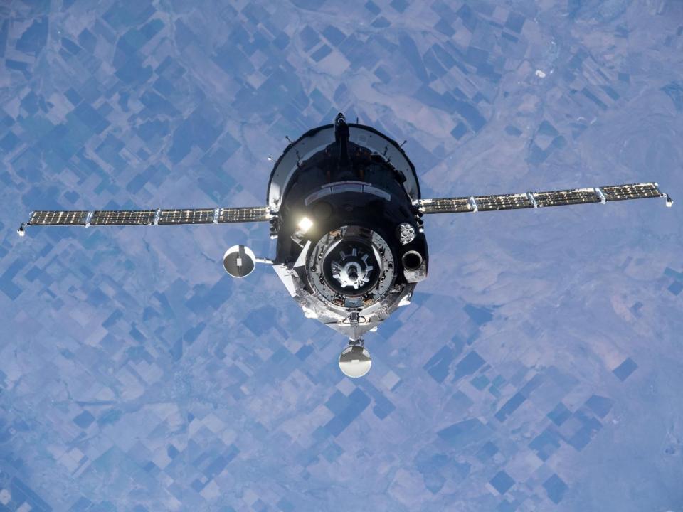 soyuz spaceship above earth