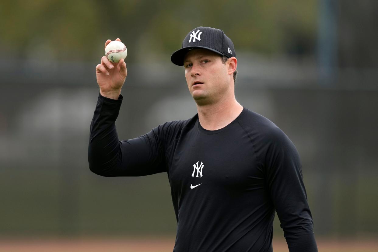 Yankees starting pitcher Gerrit Cole walks on the field during a spring training workout.