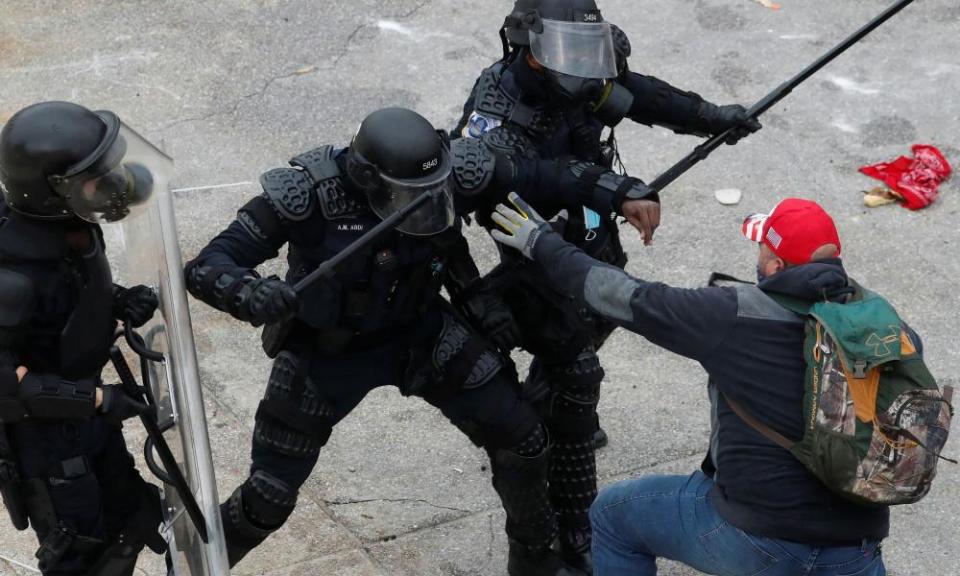 Trump protesters clash with police outside the Capitol.