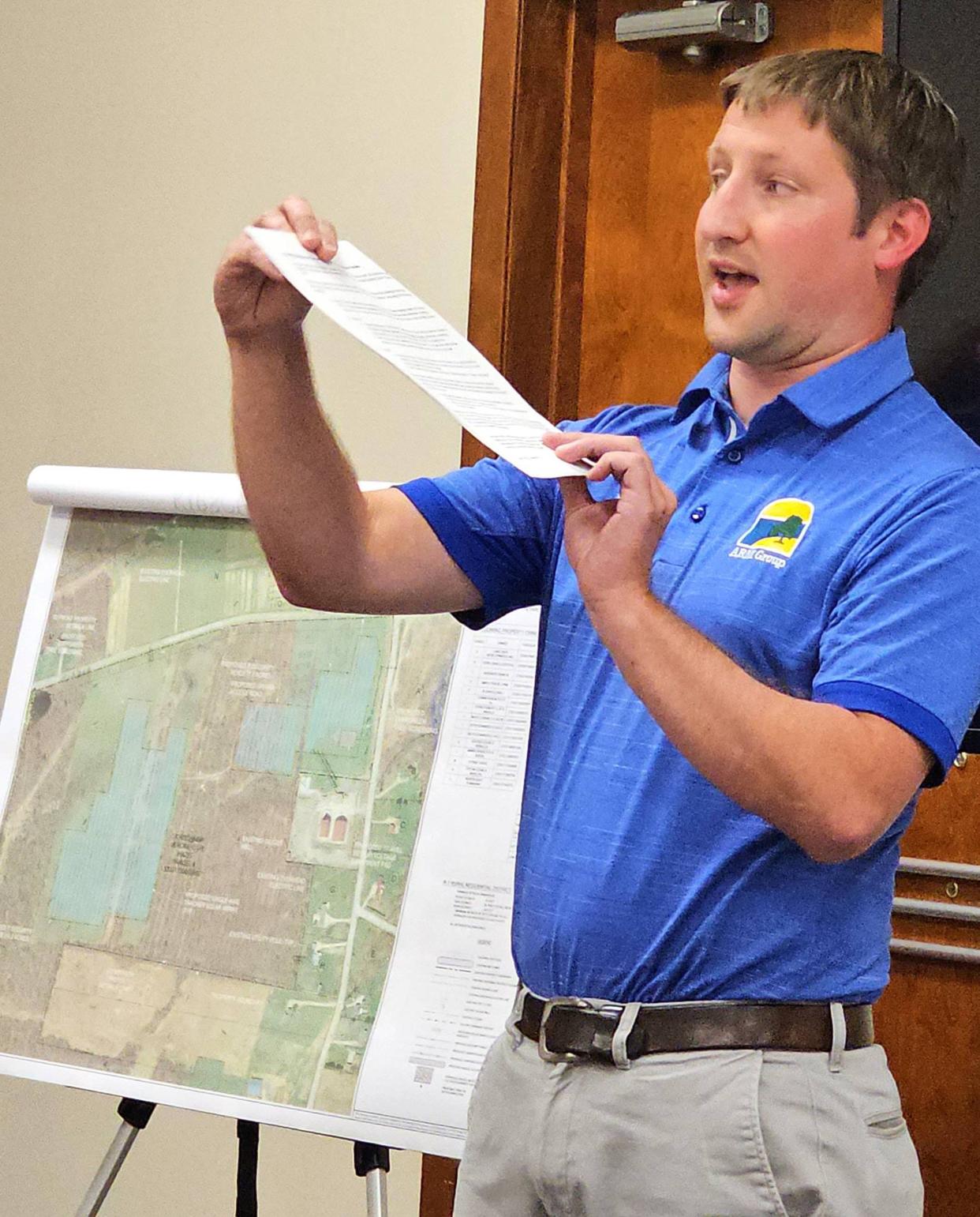 Engineer Daniel Long of ClearChoice Energy explains how solar panels rotate with the sun throughout the day. ClearChoice wants to build a 25-acre solar farm in North East Township.