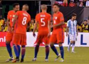 Argentina's Lionel Messi (R) reacts after missing his shot during the penalty shoot-out against Chile, during their Copa America Centenario final in East Rutherford, New Jersey, on June 26, 2016