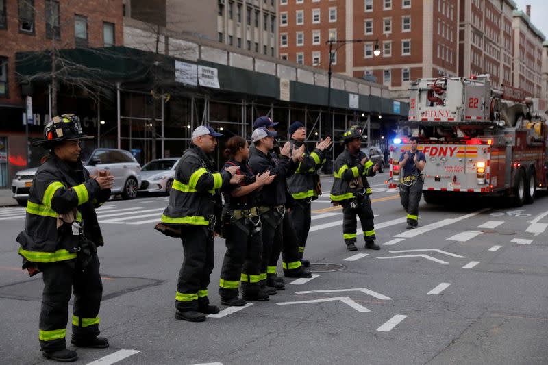 Fire crews clap for health workers during the coronavirus disease (COVID-19) outbreak in Manhattan