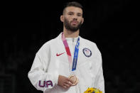 Bronze medalist. United States' Thomas Patrick Gilman celebrates on the podium for the men's 57kg Freestyle wrestling, at the 2020 Summer Olympics, Thursday, Aug. 5, 2021, in Tokyo, Japan. (AP Photo/Aaron Favila)