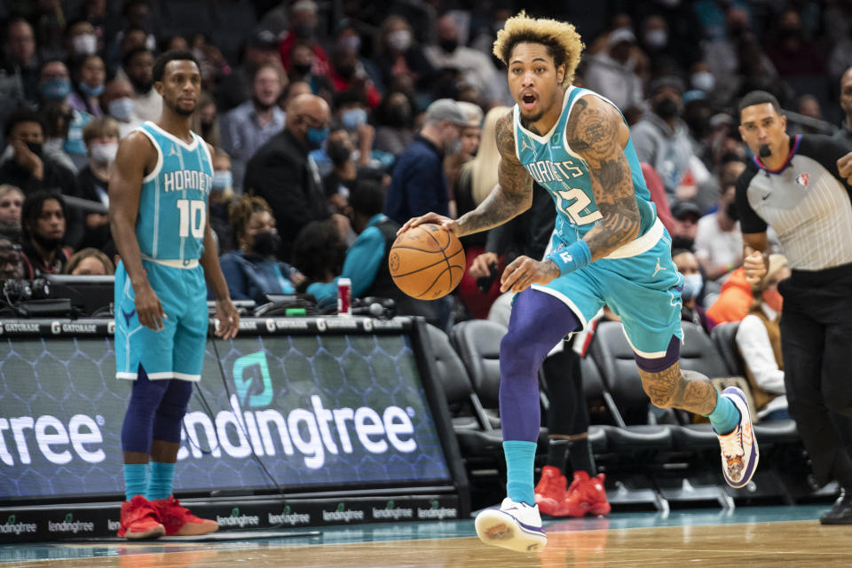 Charlotte Hornets guard Kelly Oubre Jr. (12) brings the ball up the court during the first half of an NBA basketball game against the Portland Trail Blazers, Sunday, Oct. 31, 2021, in Charlotte, N.C. (AP Photo/Matt Kelley)