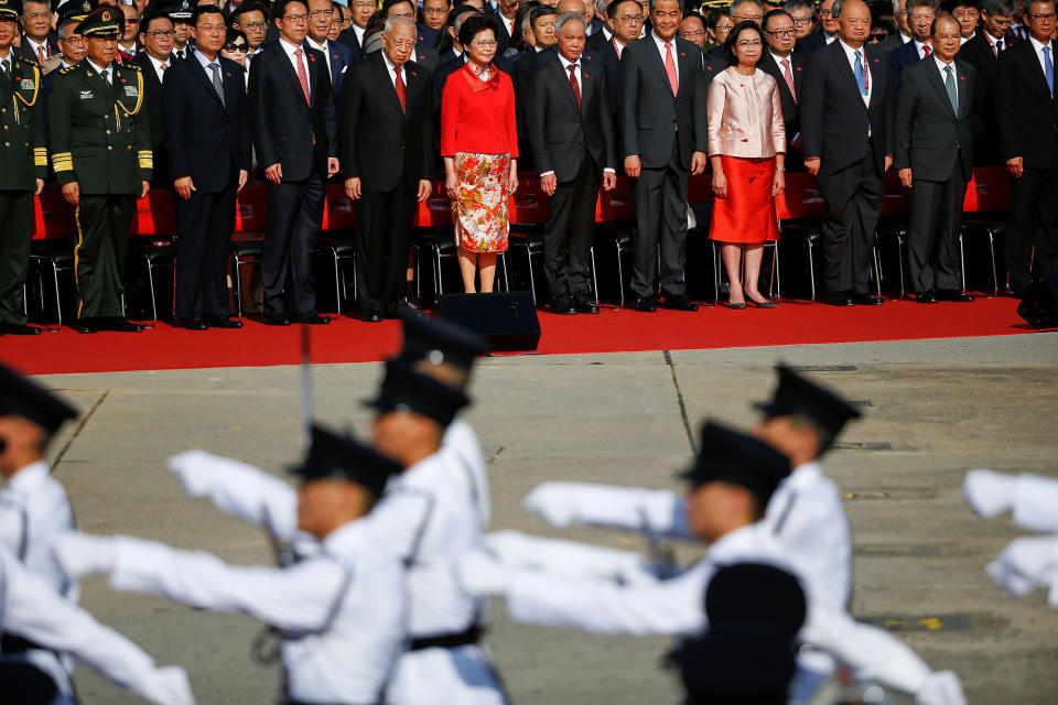 <p>Hong Kong Chief Executive Leung Chun-ying, Chief Executive-elect Carrie Lam and other officials attend a flag raising ceremony marking the 20th anniversary of the city’s handover from British to Chinese rule, in Hong Kong, China, July 1, 2017. (Photo: Damir Sagolj/Reuters) </p>