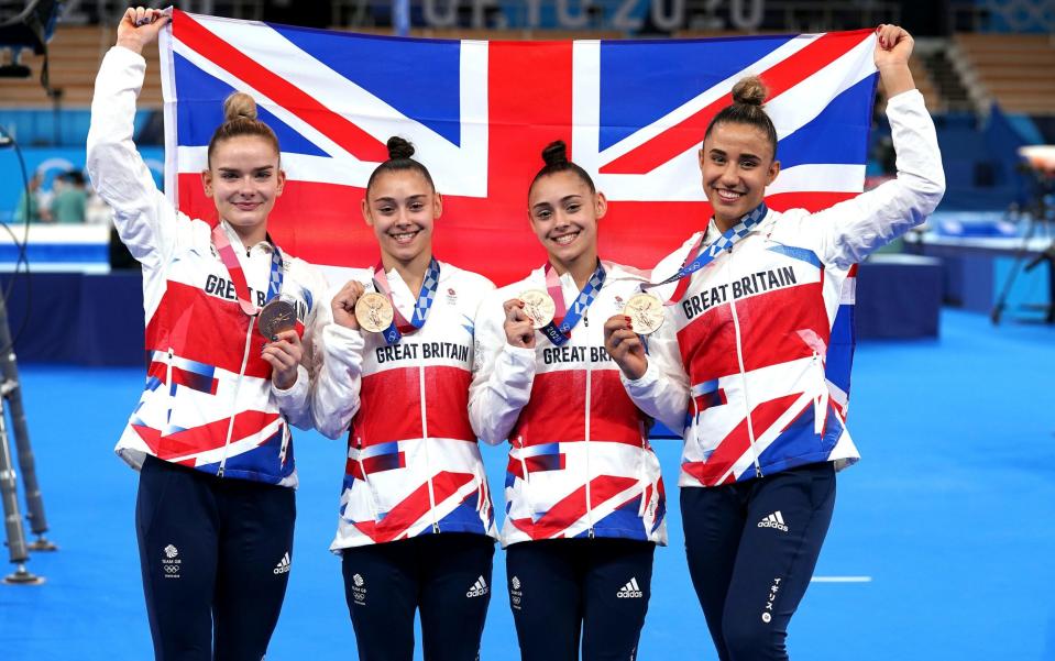 Amelie Morgan (far right) celebrates with Alice Kinsella, Jennifer Gadirova and Jessica Gadirova winning the bronze in the women's team final at the Tokyo Olympics - PA