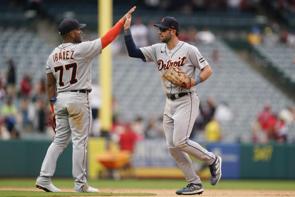 Detroit Tigers second baseman Andy Ibanez (77) high fives left fielder Matt Vierling after the team's 5-3 win against the Los Angeles Angels, Sunday, Sept. 17, 2023, in Anaheim, Calif. (AP Photo/Ryan Sun)