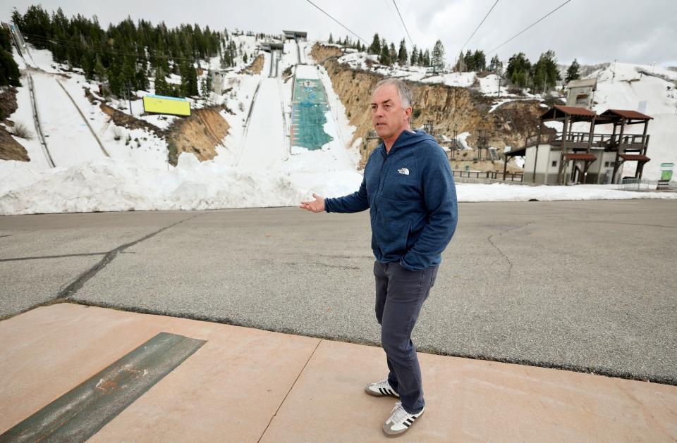 Colin Hilton, Olympic Legacy Foundation president, shows the ski jump runs at the Utah Olympic Park in Park City on Thursday, May 4, 2023. | Kristin Murphy, Deseret News